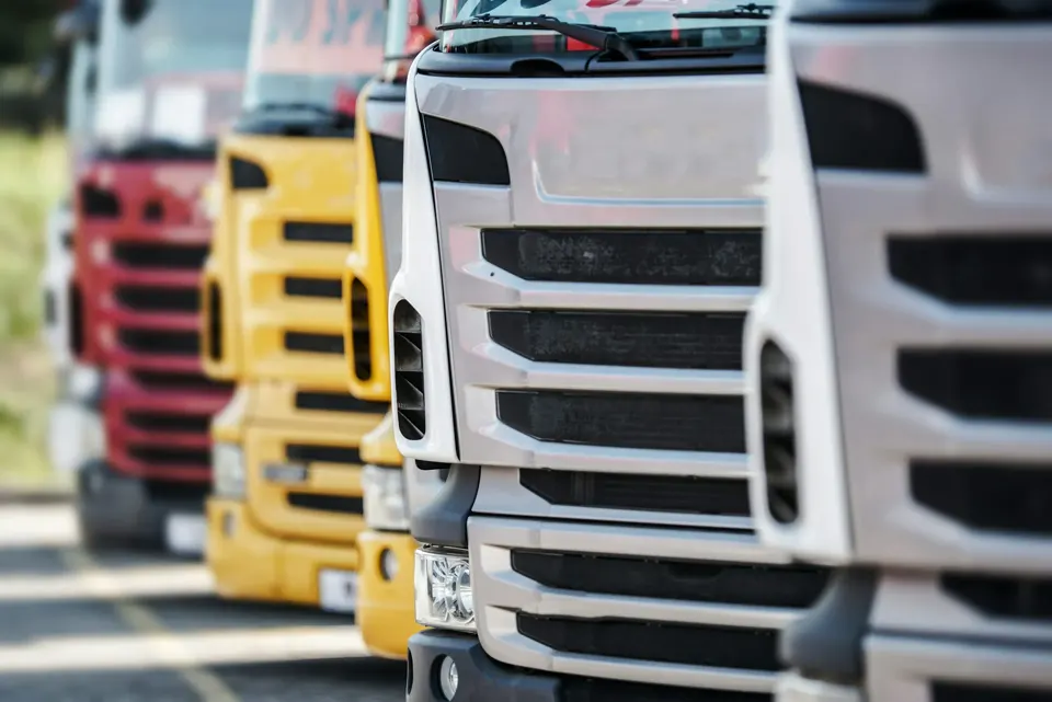 Row of trucks parked side by side